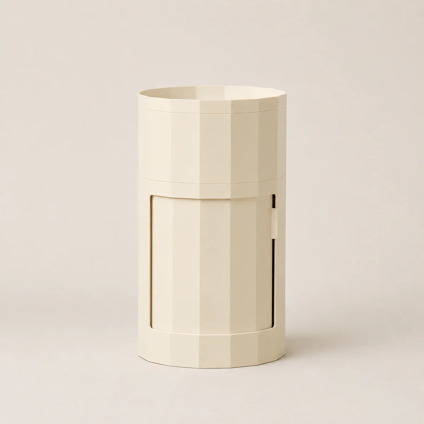 Beige cylindrical container with a handle on a light beige background