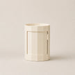 Beige cylindrical container with a rectangular cutout on a beige background