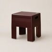 Ancora red stool on a beige background