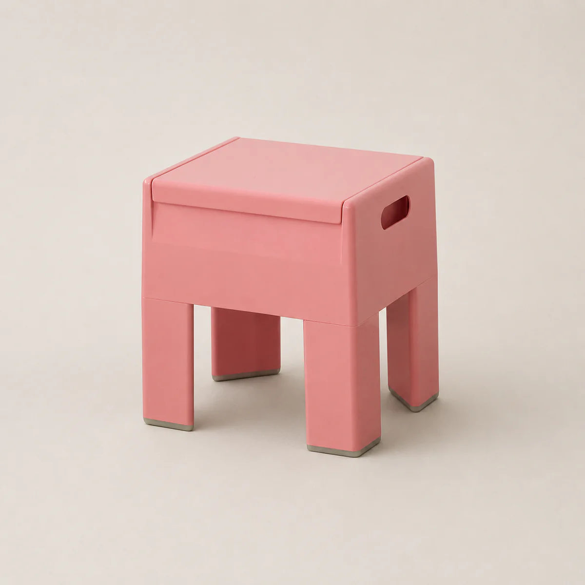Pink stool on a beige background