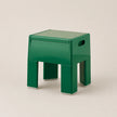 Green stool on a beige background