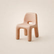 Pink textured chair on a beige background
