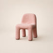 Pink textured chair on a beige background