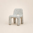 Speckled chair on a beige background