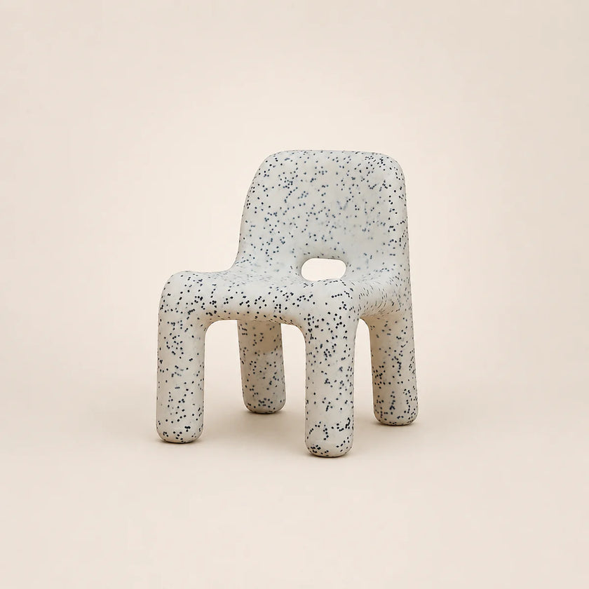 Speckled chair on a beige background