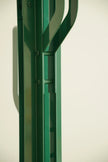 Green coat rack stand metal frame against a white background