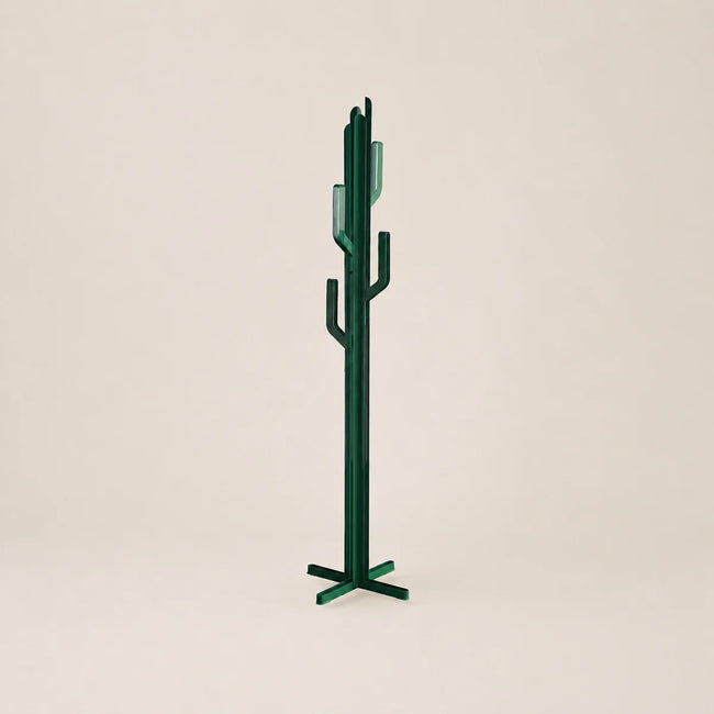 Green cactus-shaped coat rack on a beige background