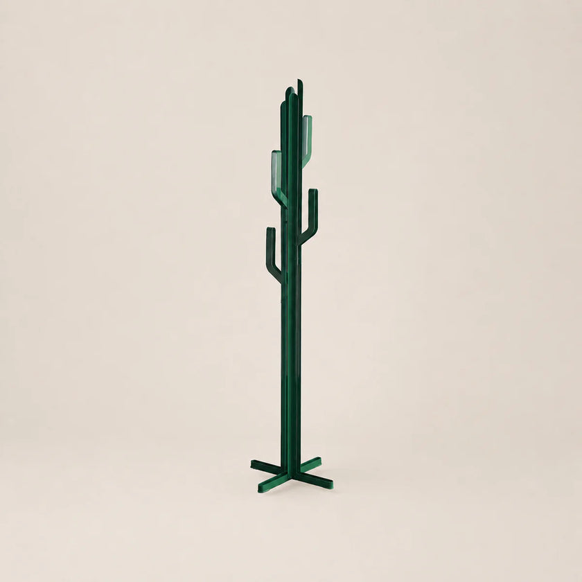 Green cactus-shaped coat rack on a beige background