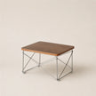 Wooden table with metal frame on a beige background