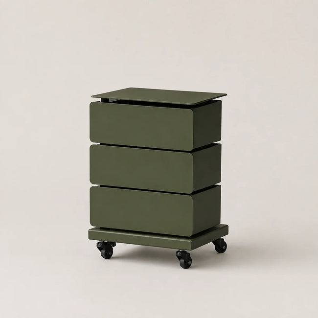An olive green three-drawer rolling storage cabinet with a flat top and black caster wheels, photographed on a clean, light beige studio background.