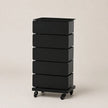 A black 5-drawer rolling storage cabinet with a sleek, modern rectangular design and black caster wheels, shown on a neutral beige background.