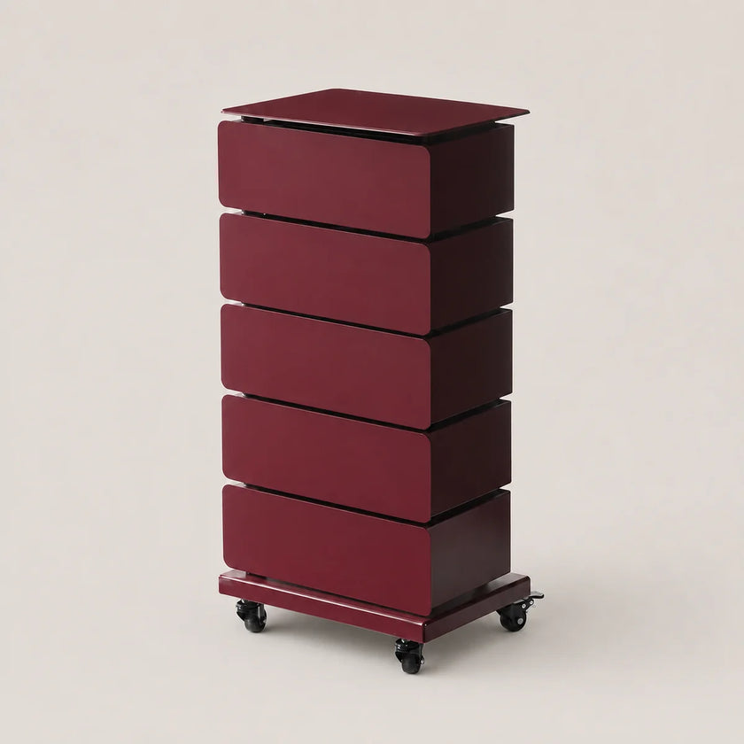 A tall, five-drawer rolling storage cabinet in a deep burgundy finish, featuring a flat top and black caster wheels, set against a solid light beige background.