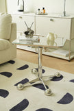 Modern side tables living room with glass top and chrome legs in a living room setting.