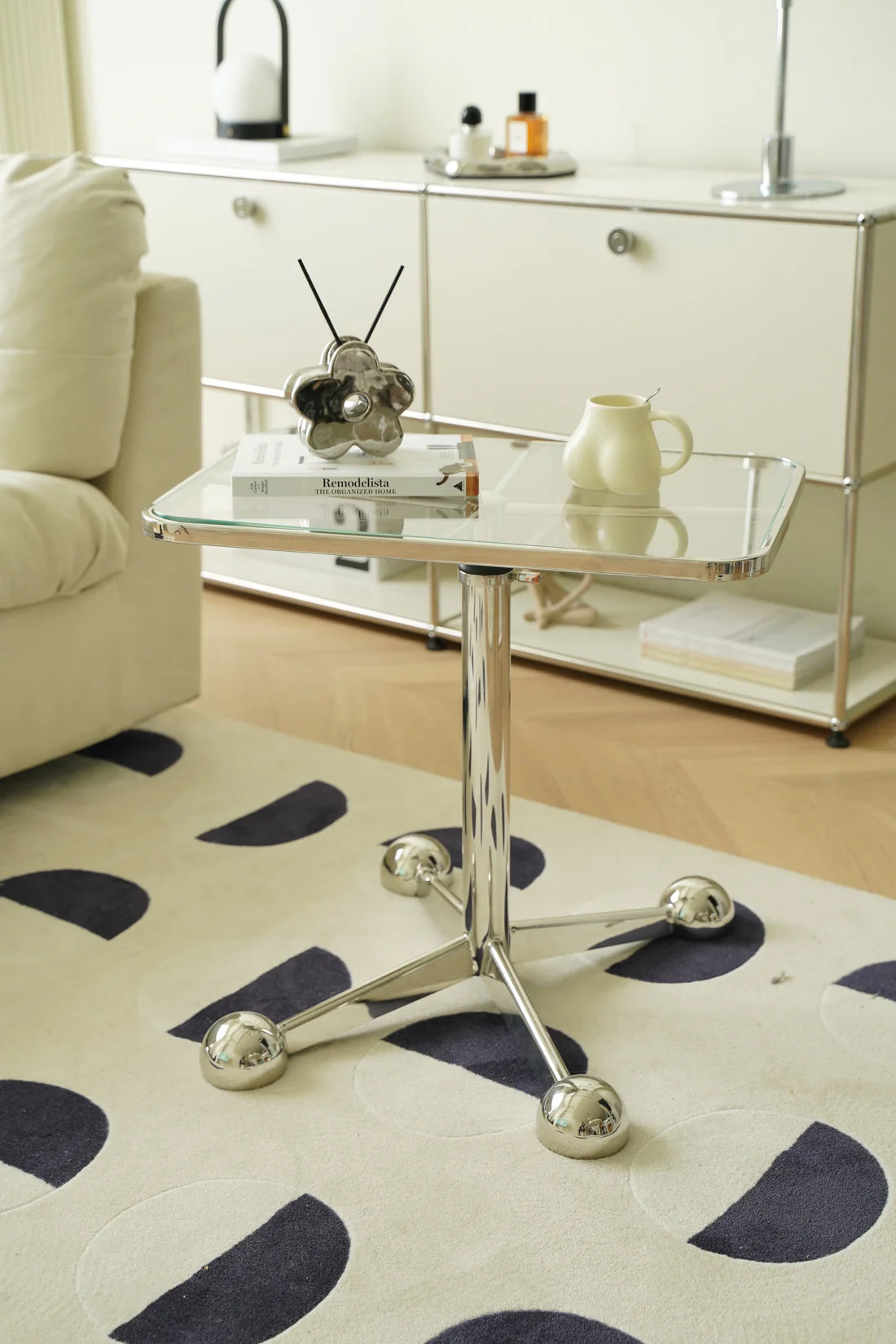 Modern side tables living room with glass top and chrome legs in a living room setting.