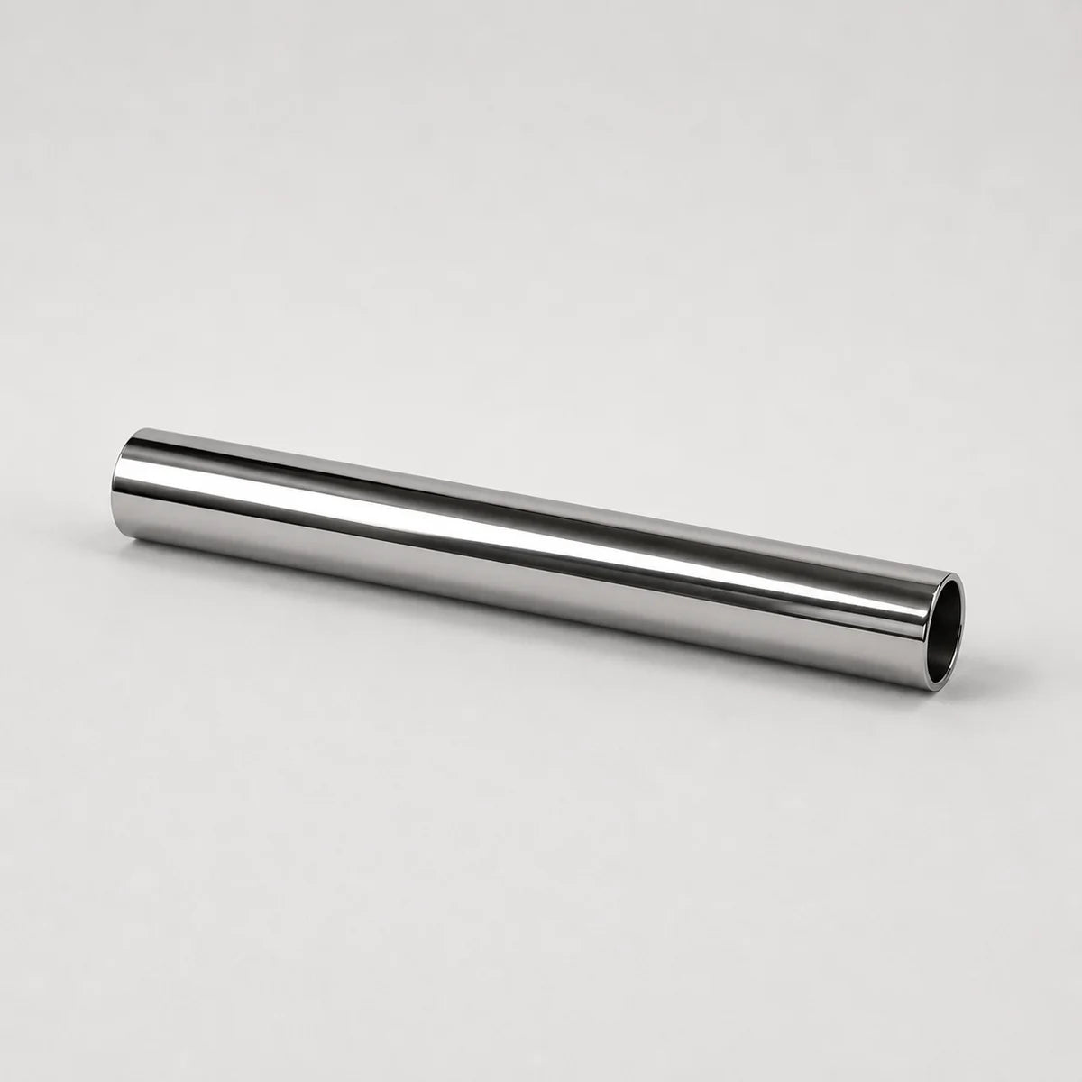 A polished metallic silver cylindrical rod or tube, shown diagonally on a clean, light gray studio background.