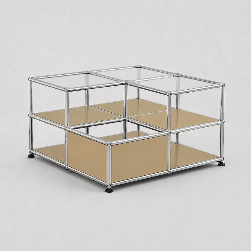 A modular cube storage organizer with a chrome metal frame, clear glass panels on the top, beige cardboard inserts on the middle and bottom shelves, and small black feet at the base, shown on a light gray background.