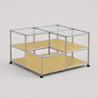 A modular two-tier storage shelf unit with a silver aluminum frame, clear glass top panels, and mustard yellow shelves, shown on a light gray background.