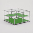 A modular metal and glass storage unit with green panels, shown on a light gray background.