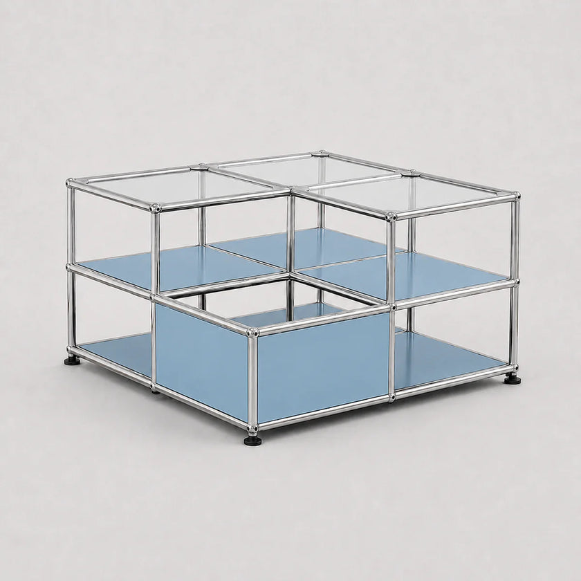 A modular two-tier storage organizer with a chrome metal frame, clear glass top panels, and light blue shelves, shown on a neutral light gray background.