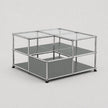 A modular two-tier storage organizer with a chrome metal frame, clear glass top panels, and gray shelves, shown on a light gray background.