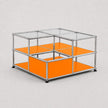 A modular two-tier storage unit with a chrome metal frame, clear glass panels, and bright orange shelves, shown on a light gray background.