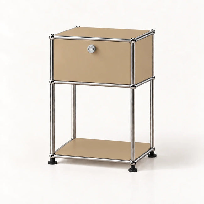 A modern two-tier storage cabinet with a silver chrome tubular metal frame and beige metal panels, featuring a single upper drawer with a silver lock and a lower open shelf.