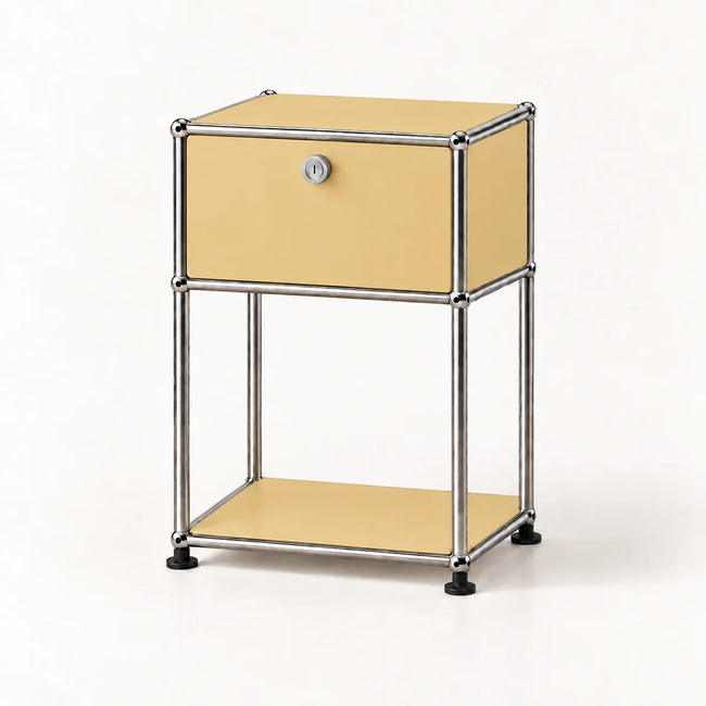 A modern two-tier nightstand with a goose yellow laminate finish and a chrome tubular metal frame, featuring a single drawer with a lock and a lower open shelf.