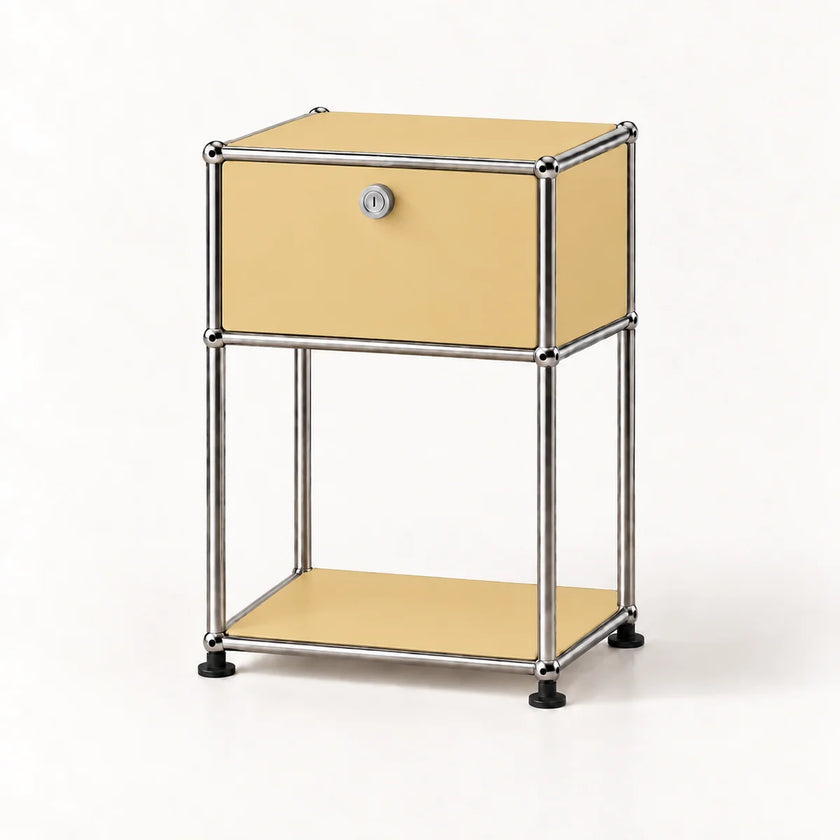 A modern two-tier nightstand with a goose yellow laminate finish and a chrome tubular metal frame, featuring a single drawer with a lock and a lower open shelf.