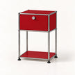 A modern two-tier nightstand featuring a vibrant red enamel finish and a chrome tubular steel frame with black rubber feet, shown on a clean white background.