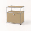 A two-tier storage cabinet with a silver chrome metal frame and beige metal panels, featuring a lock on the lower door and black rubber feet, set against a plain white background.