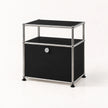 A modern two-tier storage cabinet with a black metal-covered body, a chrome metal frame, and a small silver lock on the front door, set against a plain white background.