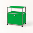 A modern two-tier storage cabinet with bright green panels and a chrome metal frame, featuring a small silver lock on the lower door and black feet, set against a plain white background.