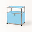 A two-tier storage cabinet with light blue panels and a chrome metal frame, featuring a single lockable lower drawer with a round silver knob and black feet, set against a plain white background.