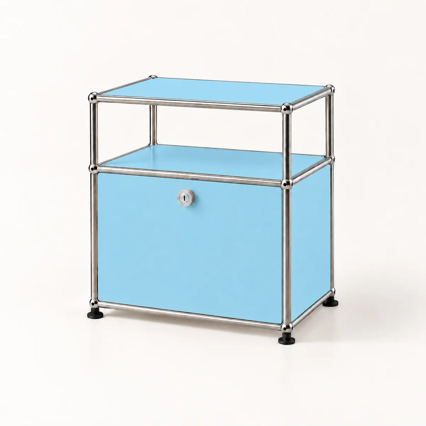 A two-tier storage cabinet with light blue panels and a chrome metal frame, featuring a single lockable lower drawer with a round silver knob and black feet, set against a plain white background.