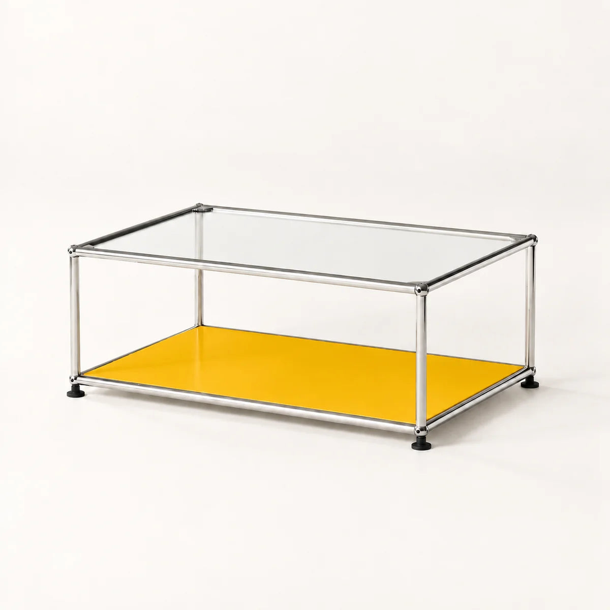 A modern rectangular coffee table with a clear glass top, a stainless metal frame, and a bright yellow metal lower shelf, shown on a clean white background.