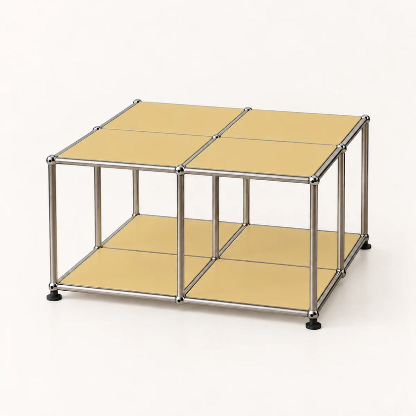 A modular metal storage cube with four beige panels on top and a lower shelf, supported by a stainless chrome frame with black feet, shown on a white background.
