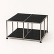 A modular cube storage organizer with a stainless metal frame and black panels on a clean white background.