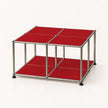 A modular cube-shaped storage shelf with a chrome stainless metal frame and bright red panels on the top and bottom shelves, set against a plain white background.