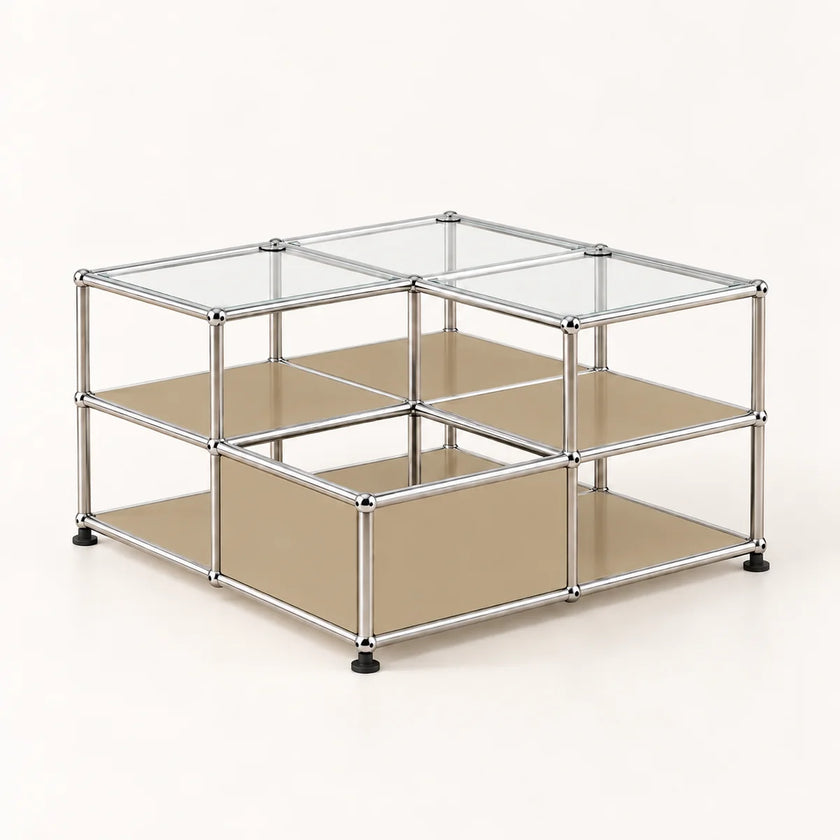 A modular two-tier storage organizer with a chrome metal frame, clear glass top panels, and beige metal shelves, shown on a light cream background.