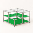 A modular storage organizer made of a chrome metal frame with green glass shelves and clear glass top panels, shown on a clean white background.
