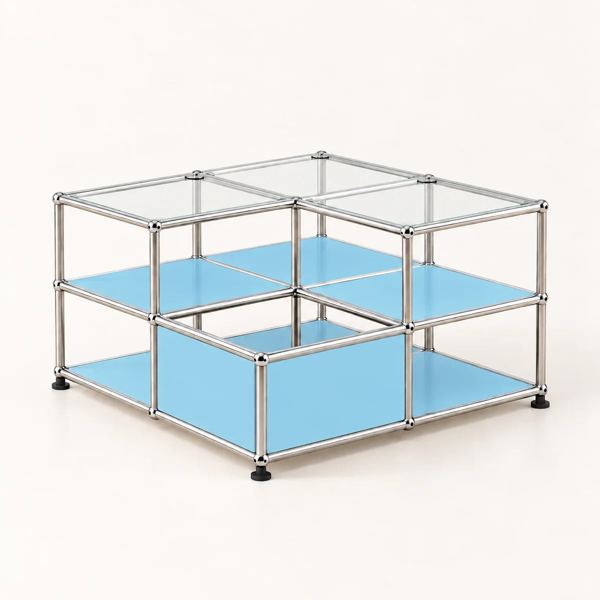 A modular two-tier storage organizer made of a chrome metal frame with light blue metal shelves and clear glass top panels, shown on a clean off-white background.