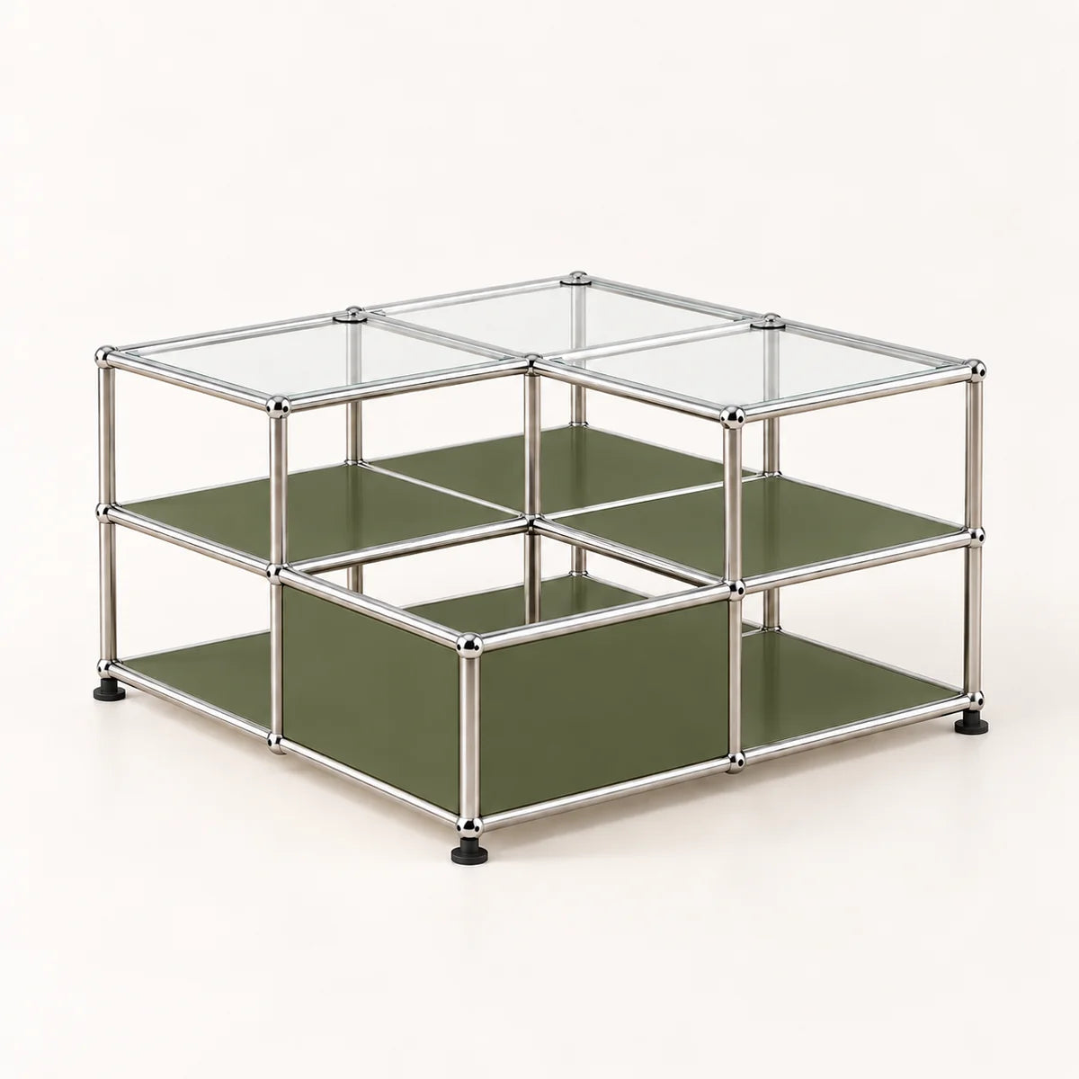 A modular two-tier storage organizer made of a chrome metal frame with olive green panels and clear glass top lids, shown on a light cream background.