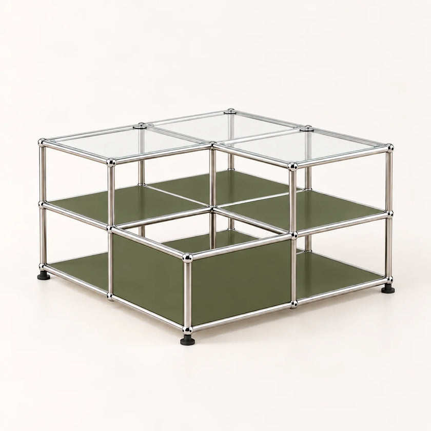 A modular two-tier storage organizer made of a chrome metal frame with olive green panels and clear glass top lids, shown on a light cream background.