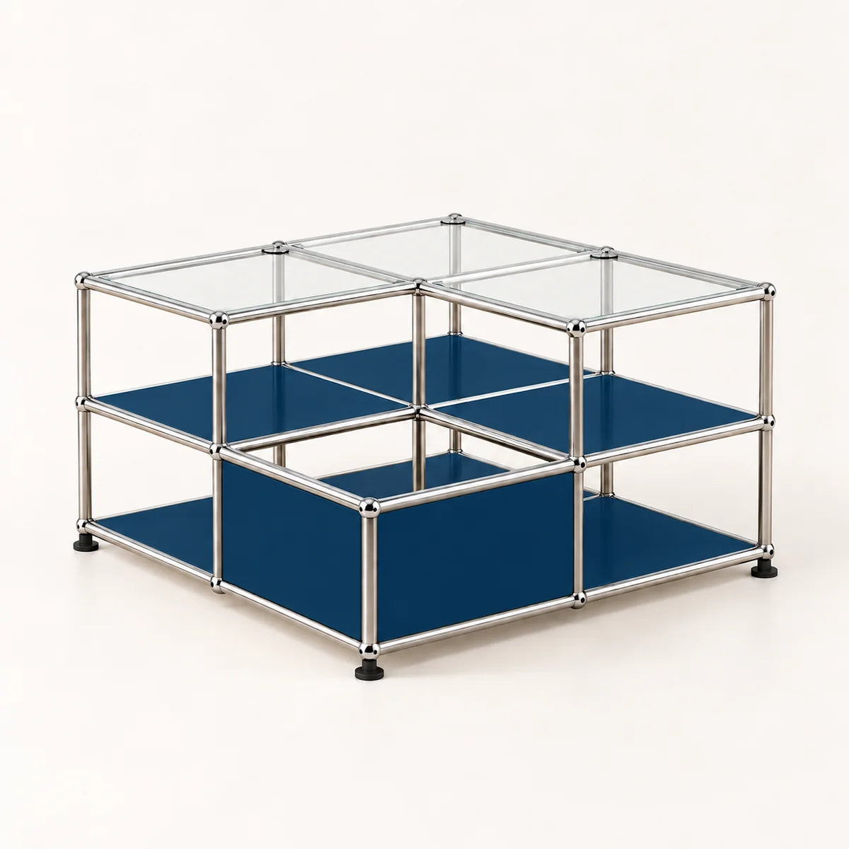 A modular two-tier storage unit with a chrome metal frame, clear glass top panels, and dark blue shelves, shown on a light beige background.