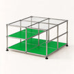 A modular metal storage organizer with a chrome stainless frame, clear glass top panels, and bright green shelves, shown on a clean white background.