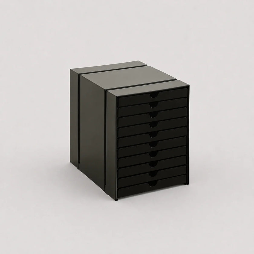 Black file cabinet with multiple drawers on a light gray background