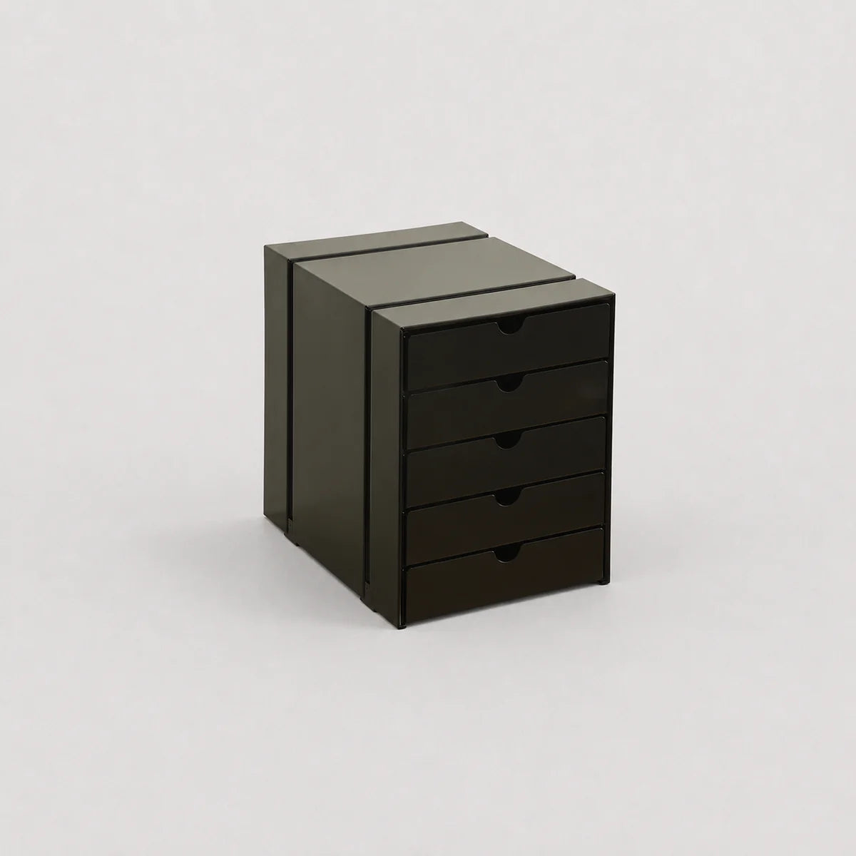 Black metal cabinet with drawers on a white background