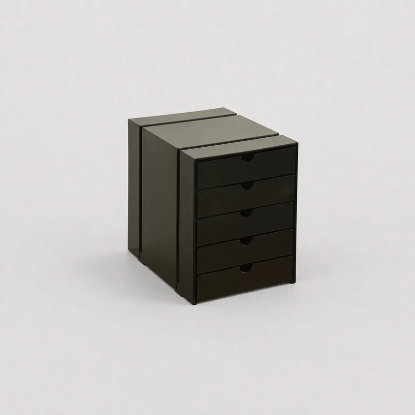 Black metal cabinet with drawers on a white background