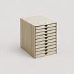 Beige storage cabinet with multiple drawers on a light gray background