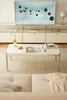 Modern living room with a flat-screen TV, replica USM modular coffee table, and sofa.